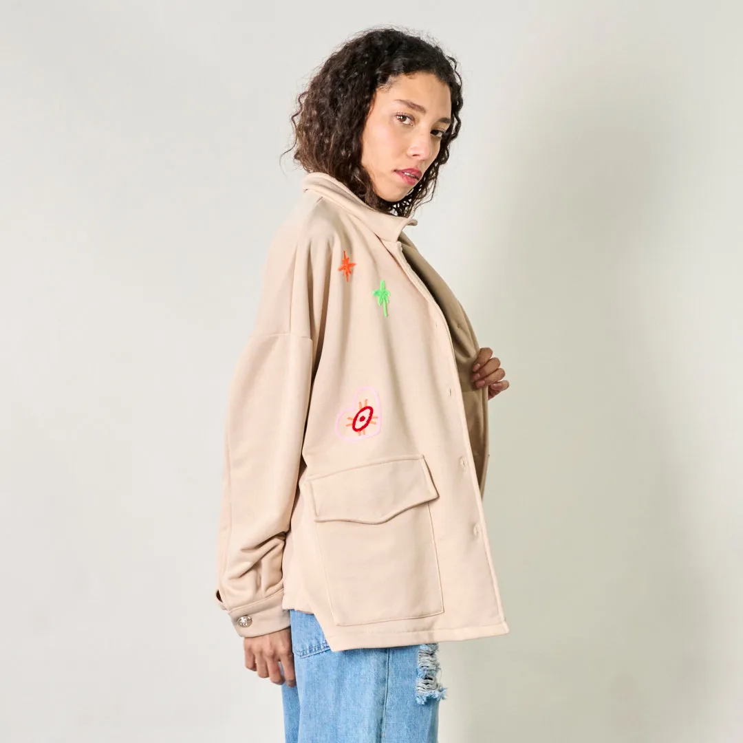 Button-up jacket with playful embroidered details wholesale